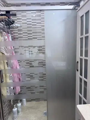 a walk in shower with a glass door in a bathroom at Casa Coplas muy cerca de la playa in Sanlúcar de Barrameda