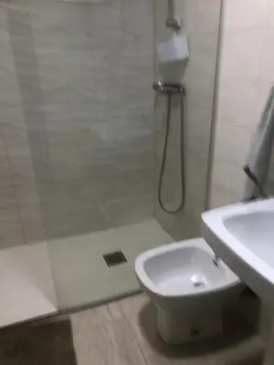 a bathroom with a shower and a toilet and a sink at Puerto centro in El Puerto de Santa María