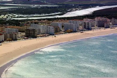 an aerial view of a beach and the ocean at Corales 6 in El Puerto de Santa María