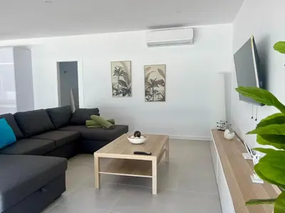a living room with a couch and a coffee table at El Paraíso in Chiclana de la Frontera
