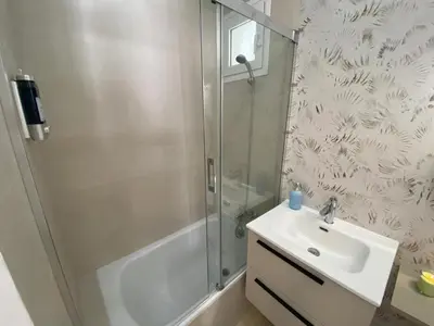 a bathroom with a shower and a sink at Sol Sherry in Jerez de la Frontera