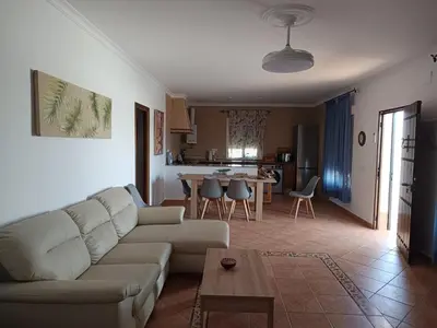 a living room with a couch and a table at Lakuarta in Hozanejos