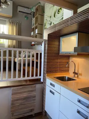 a kitchen with a sink and a crib at Puerto Sherry Bali in El Puerto de Santa María