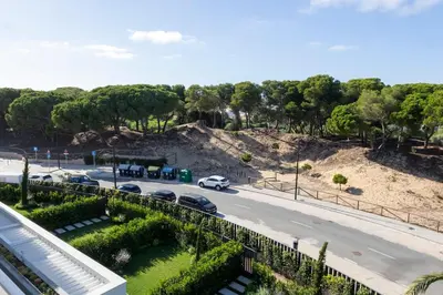 a view of a street with cars on a road at GINVA - Luxury Beachfront Apartment in El Puerto de Santa María