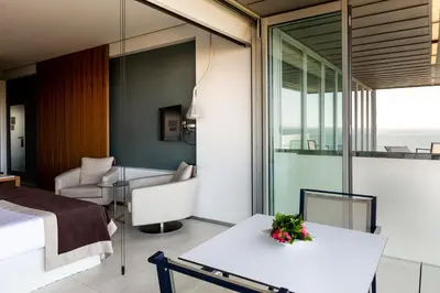 a bedroom with a bed and a room with a view at Parador de Cádiz in Cádiz
