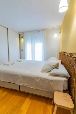 a bedroom with a large bed and a window at SH Brisa de la Viña. Cerca de la Playa. AC, WIFi in Cádiz