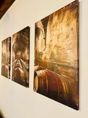 three paintings of a barrel on a wall at Apartamento con Entreplanta Alegría de Jerez in Jerez de la Frontera