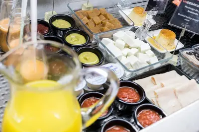 a buffet of food with cheese and other foods at Parador de Arcos de la Frontera in Arcos de la Frontera