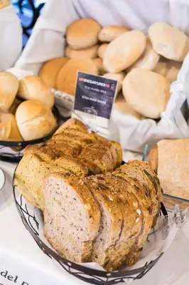 a display of bread and buns on a table at Parador de Arcos de la Frontera in Arcos de la Frontera