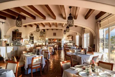 a dining room with white tables and chairs at Parador de Arcos de la Frontera in Arcos de la Frontera