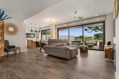 a living room with a couch and a table at Villa Paradisus Golf & Wellnes in Cádiz