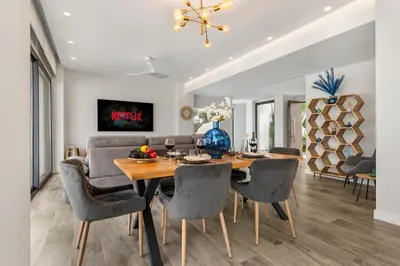 a dining room with a table and chairs at Villa Paradisus Golf & Wellnes in Cádiz