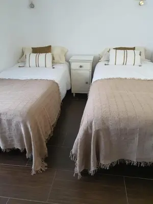 two beds sitting next to each other in a room at Mina5 in Cádiz