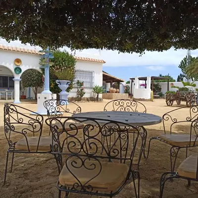 a table and chairs sitting in a courtyard at Alojamiento Rural 