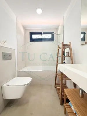 a bathroom with a toilet and a sink at Villa Foreber in Chiclana de la Frontera