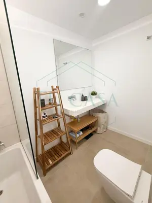 a bathroom with a toilet and a sink and a bath tub at Villa Foreber in Chiclana de la Frontera