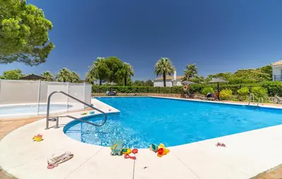 a swimming pool with a slide in the middle at Pet Friendly Home In Arcos De La Frontera in Arcos de la Frontera
