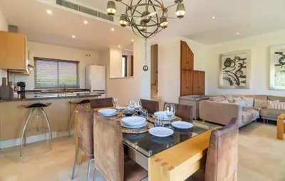 a dining room and living room with a table and chairs at Pet Friendly Home In Arcos De La Frontera in Arcos de la Frontera