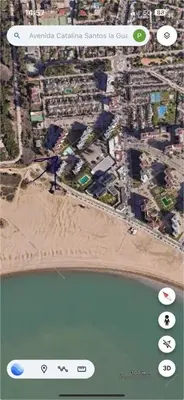 a screenshot of a cell phone screen with a beach at Valdelagrana del Mar in El Puerto de Santa María