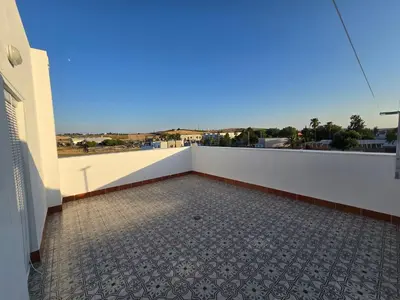 a view from the balcony of a building with a tile floor at Piso El IDEAL in Lebrija