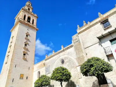 a large building with a clock tower on top of it at Piso El IDEAL in Lebrija