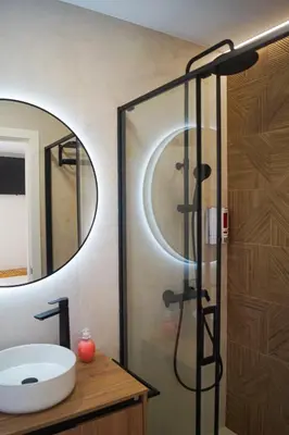 a bathroom with a sink and a shower at Alojamientos Dunas del Alba in Chipiona