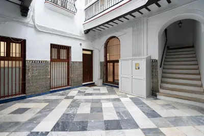 an empty building with a staircase and a tiled floor at CDZ - Santiago Terry in Cádiz
