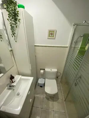 a bathroom with a toilet and a sink and a shower at Villa Marina in Chipiona