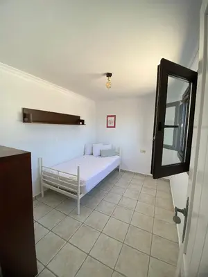 a bedroom with a bed and a mirror at Villa Marina in Chipiona