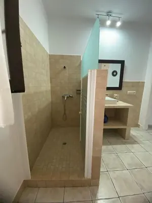 a bathroom with a shower and a sink at Villa Marina in Chipiona