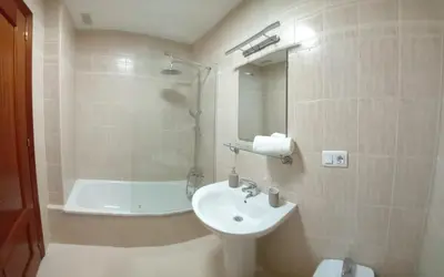 a bathroom with a sink and a tub and a toilet at Castle in Sanlúcar de Barrameda