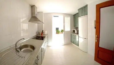 a kitchen with a sink and a counter top at Castle in Sanlúcar de Barrameda