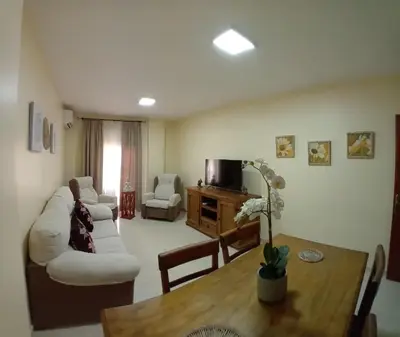 a living room with a couch and a table at Castle in Sanlúcar de Barrameda