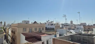 an aerial view of a city with buildings at Torre 49 in Cádiz