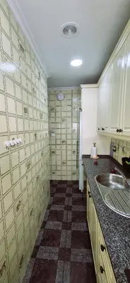 a kitchen with a sink and a counter top at Torre 49 in Cádiz
