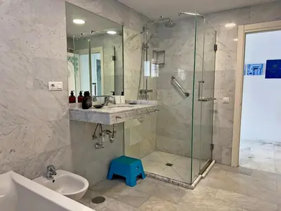 a bathroom with a shower and a sink and a toilet at Casa Las Cumbres I - Ole Solutions in El Puerto de Santa María