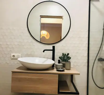 a bathroom with a sink and a mirror at Costa El Castillo La Barrosa in Poblado de Sancti Petri