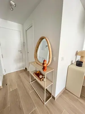 a room with a table with a mirror on it at Housfy Beach Costa Ballena by Sanlúcar Housing in Chipiona