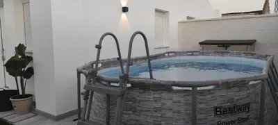 a hot tub in a brick basketificialificialificialificialificialificialificialificialificial at Villa Kaki in Conil de la Frontera
