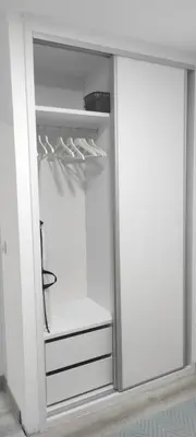 an empty refrigerator with its door open in a room at Villa Kaki in Conil de la Frontera