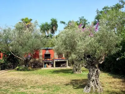 a house with trees in front of it at Mis Tres Centenarios in El Puerto de Santa María