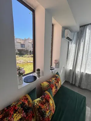 a living room with a couch and a window at Bungalow Bahia Sur 33 in San Fernando