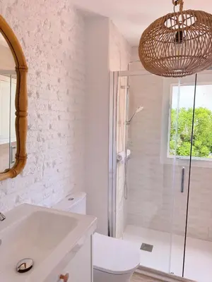 a bathroom with a shower and a white sink at Sibs Sanlucar - casita playa - coqueto vistas in Sanlúcar de Barrameda