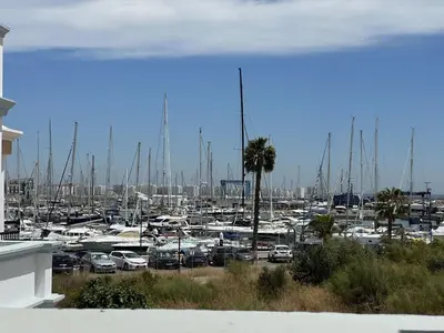 a marina with alot of boats in a harbor at Apartoyou Nuevo Puerto Sherry in El Puerto de Santa María