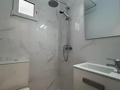 a bathroom with a shower and a sink at Apartoyou Nuevo Puerto Sherry in El Puerto de Santa María