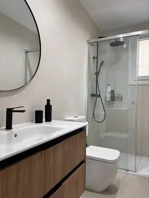 a bathroom with a sink and a toilet and a shower at Casa Keito, Playa y Patio in Cádiz