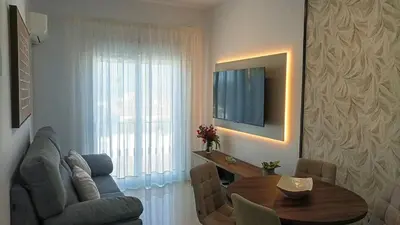 a living room with a couch and a table at Chiclana Apartamento zona playa in Chiclana de la Frontera