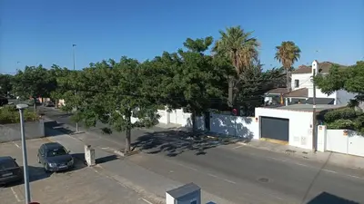 a street with a car parked on the side of the road at Chiclana Apartamento zona playa in Chiclana de la Frontera