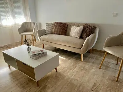 a living room with a couch and a coffee table at Apartamento Taymar Daniel in Chiclana de la Frontera