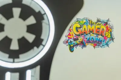 a clock with a video game game logo on it at Increíble Villa en campo de golf in Novo Sancti Petri